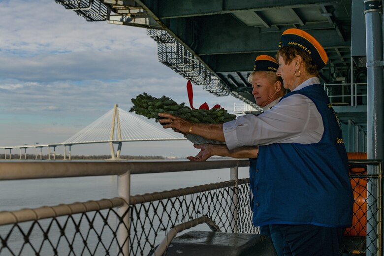 Two members from the Fleet Reserve Association, branch number 269, cast a wreath over the side of USS Yorktown during the 77th Pearl Harbor Memorial Day recognition ceremony Dec. 7, 2018, onboard USS Yorktown Naval and Maritime Museum in Mount Pleasant, S.C. Service members and civilians from Joint Base Charleston were among the approximately 200 people attended the event to honor the service and sacrifice of those who died in the Pearl Harbor attacks on Dec. 7, 1941. In all, more than 2,403 U.S. service members and civilians lost their lives, including 25 from South Carolina. The ceremony featured speeches from three veterans present during the attacks on Pearl Harbor, the laying of over 90 wreaths and a 21-gun salute