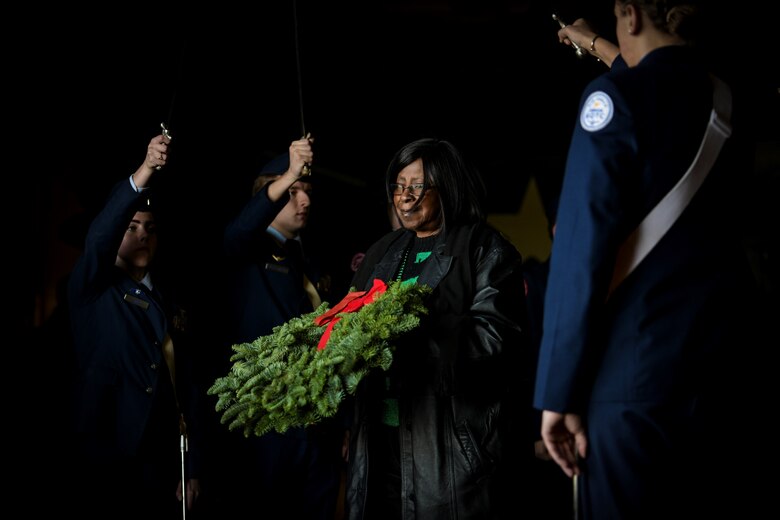 A volunteer proceeds the side of USS Yorktown carrying a wreath during the 77th Pearl Harbor Memorial Day recognition ceremony Dec. 7, 2018, onboard USS Yorktown Naval and Maritime Museum in Mount Pleasant, S.C. Service members and civilians from Joint Base Charleston were among the approximately 200 people attended the event to honor the service and sacrifice of those who died in the Pearl Harbor attacks on Dec. 7, 1941. In all, more than 2,403 U.S. service members and civilians lost their lives, including 25 from South Carolina. The ceremony featured speeches from three veterans present during the attacks on Pearl Harbor, the laying of over 90 wreaths and a 21-gun salute. (Photo by Airman 1st Class Joshua Maund)