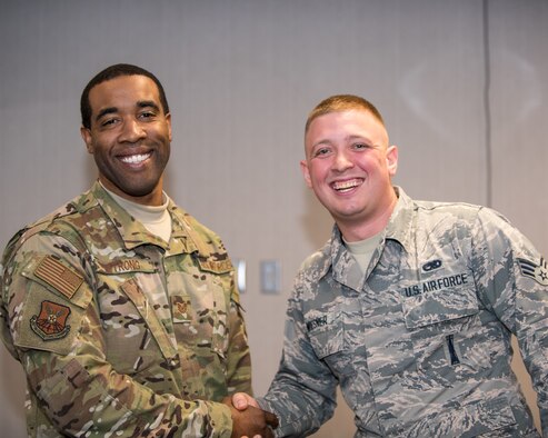 Tech. Sgt. LaRon Strong, 2nd the 2nd Operations Support Squadron aircraft support section chief, and Senior Airman Spencer Wiesner, 2nd Munitions Squadron line delivery chief, pose for a photo after the Diamond Sharp Award (DSA) ceremony at Barksdale Air Force Base, La., Nov. 21, 2018. Wiesner won the DSA for the month of November. (U.S. Air Force photo by Airman 1st Class Lillian Miller)