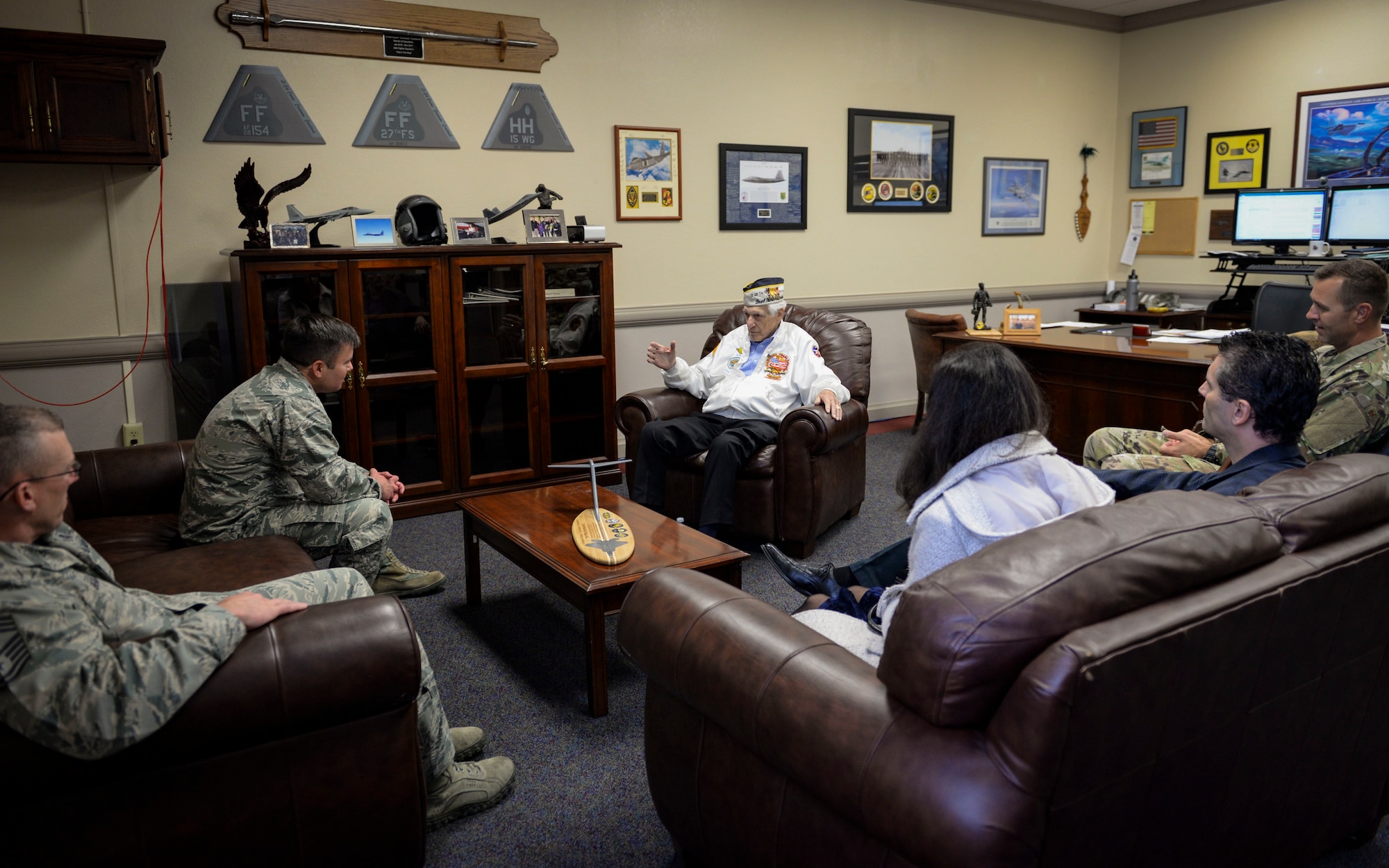 Ed Hall, Pearl Harbor Survivor, recalls his Pearl Harbor attacks experience with 99th Air Base Wing leadership Dec. 7, 2018 at Nellis Air Force Base, Nevada. Hall spent National Pearl Harbor Remembrance Day touring Nellis and visiting Airmen. (U.S. Air Force photo by Airman 1st Class Bailee A. Darbasie)