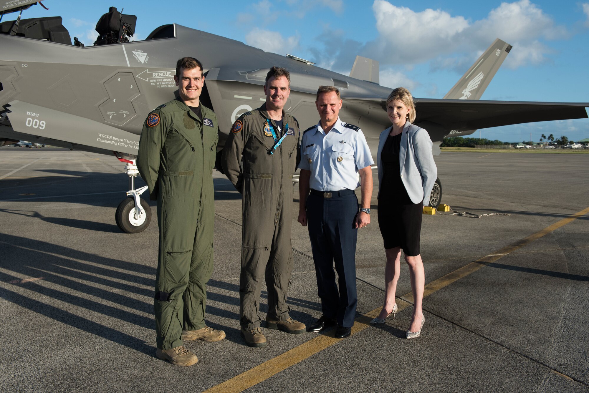 Royal Australian Air Force Flight Lieutenant Ben Monaghan, RAAF Wing Commander Darren Clare, No. 3 Squadron commander, U.S. Air Force Maj. Gen. Russ Mack, Pacific Air Forces deputy commander, and Sally Timbs, Australian Consul, Defense Policy, pose for a photo in front of a RAAF F-35A at Joint Base Pearl Harbor-Hickam, Hawaii, Dec. 3, 3018.