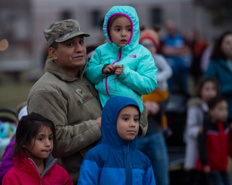 The Alvarez family awaits the arrival of Santa Claus at Kirtland Air Force Base, N.M., Dec 6, 2018. The tree lighting ceremony included building gingerbread houses, refreshments and a visit from Santa Claus. (U.S. Air Force photo by Airman 1st Class Austin J. Prisbrey)