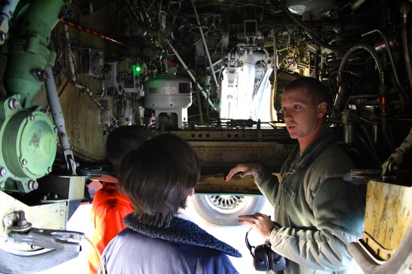 The 932nd Airlift Wing welcomed eighth Science, Technology, Engineering, and Mathematics (STEM) students for a visit.  Senior Airman Alex Jenkins, 932nd Maintenance Group, speaks to local students about how an airplane engine, wheels, tires, hydraulics and wings work to get a plane off the ground.  He manned an informational station as students rotated from Mascoutah Schools to learn more about science and engineering Dec. 10, 2018, at Scott Air Force Base, Ill.  The Air Force recognizes there is a critical need for Science, Technology, Engineering, and Mathematics (STEM) talent for future technology and innovation efforts within our nation’s STEM workforce. (U.S. Air Force photo by Lt. Col. Stan Paregien)