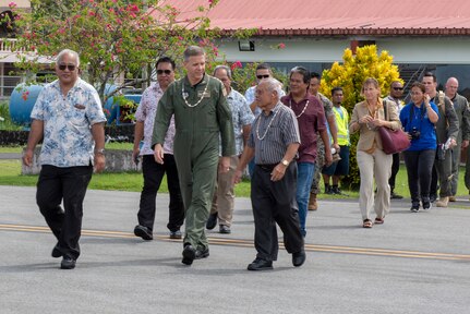 Commander, U.S. Indo-Pacific Command, Adm. Phil Davidson walks with local leaders of the Federated States of Micronesia (FSM) prior to boarding a U.S. Air Force C-130J Super Hercules during Operation Christmas Drop 2018 on the island of Chuuk, FSM, Dec. 10, 2018. The visit allowed Davidson the opportunity to not only take in the OCD mission firsthand, but also share that experience with the local community.