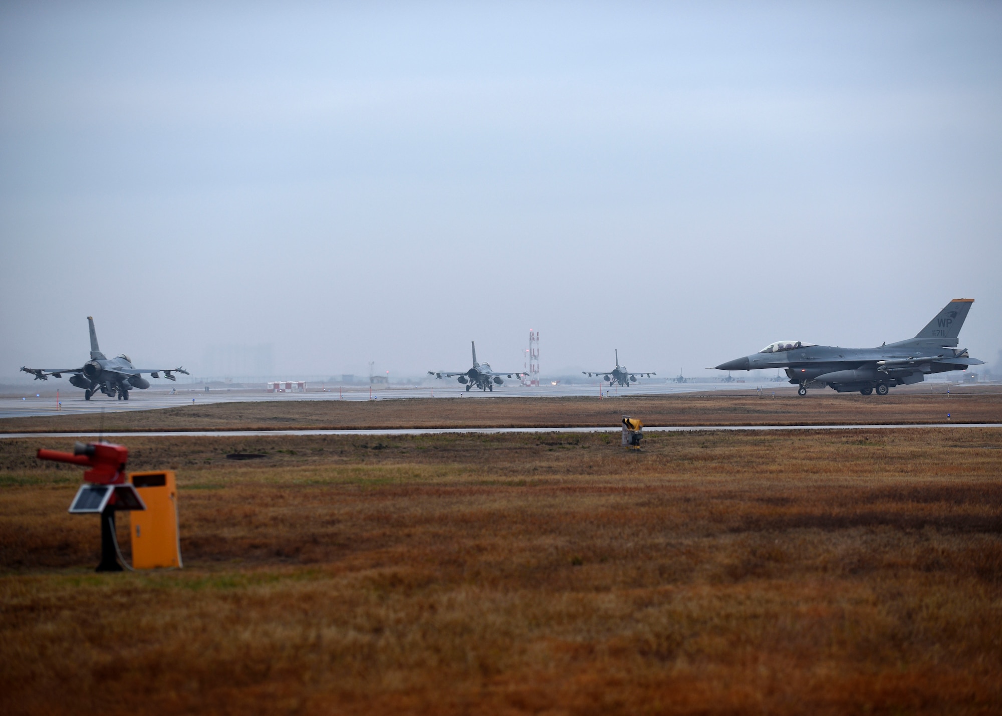 U.S. Air Force F-16 Fighting Falcons assigned to the 8th Fighter Wing taxi to the runway in preparation for takeoff at Kunsan Air Base, Republic of Korea, Dec. 3, 2018. The F-16 is a high-performance weapons system that has flown thousands of sorties in support of operations across the globe. (U.S. Air Force photo by Tech. Sgt. Charles McNamara)