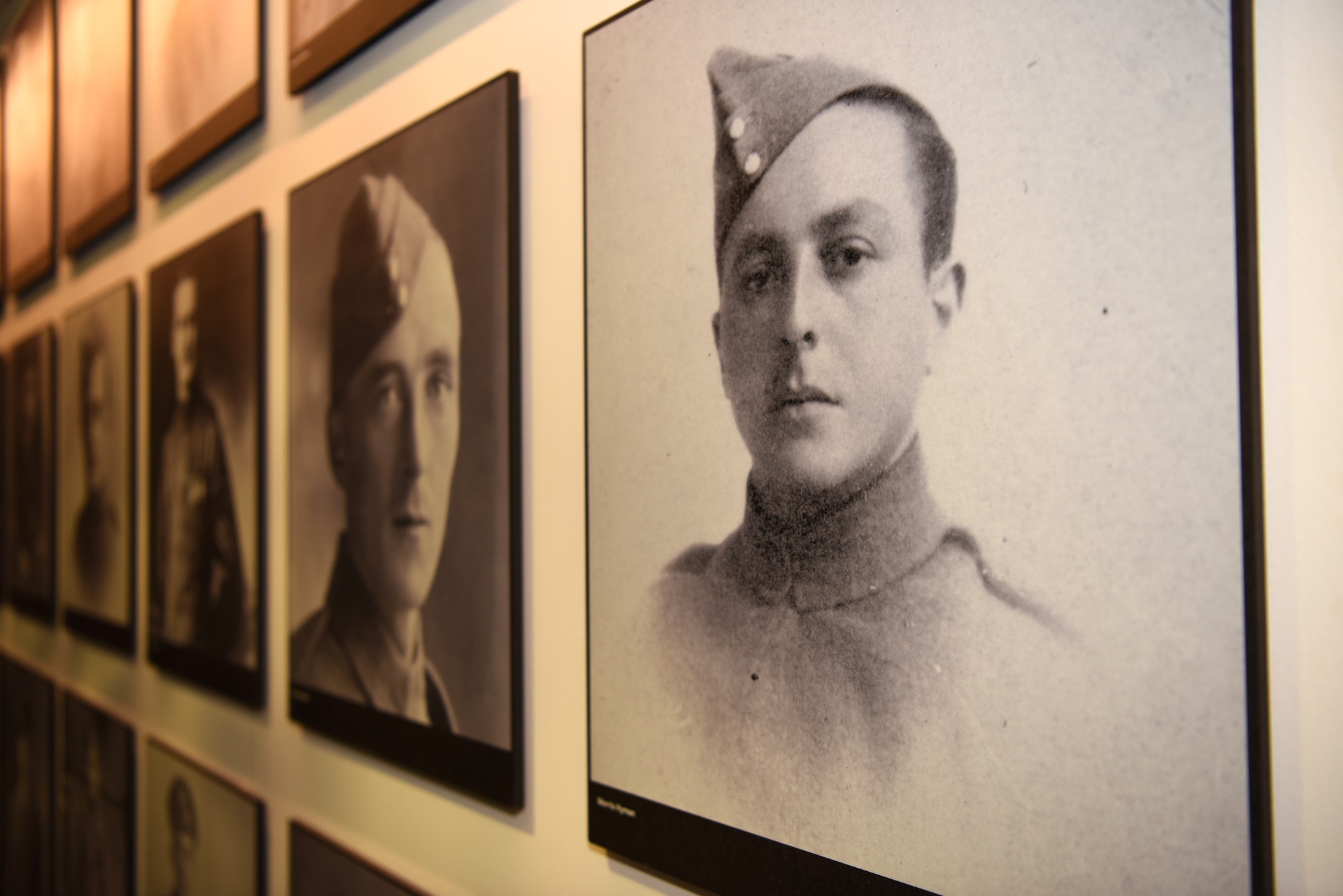 Photos of Royal Flying Corps Airmen who perished during World War I are displayed in Hangar II at the RAF Museum, London, England, Nov. 30, 2018. The RFC supported the British Army by employing artillery co-operation, photographic reconnaissance and eventually aerial battles with German pilots. (U.S. Air Force photo by Airman 1st Class Brandon Esau)