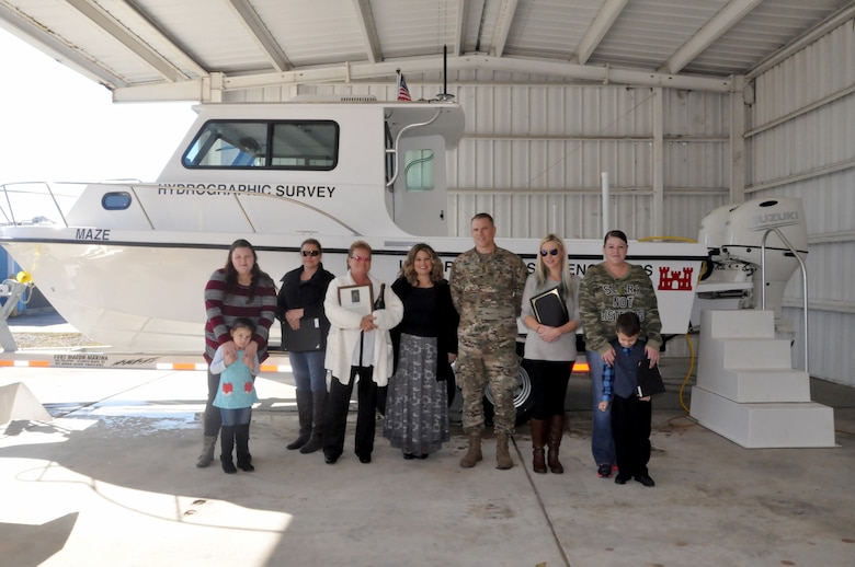 USACE, Savannah District Commander Col. David Hibner shown in front of survey vessel MAZE with the family of Anthony “Tony” Maze following the Vessel Dedication Ceremony, Dec. 7. In attendance for the ceremony were Maze’s wife Gayle, his daughters, grandchildren, and other members of his family. Also in attendance were many friends, USACE Savannah District employees, as well as USACE retirees.