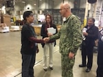 DLA Distribution commander, Navy Rear Adm. Kevin M. Jones meets with DLA Distribution Red River, Texas employees and division chiefs during his inaugural visit to the distribution center.