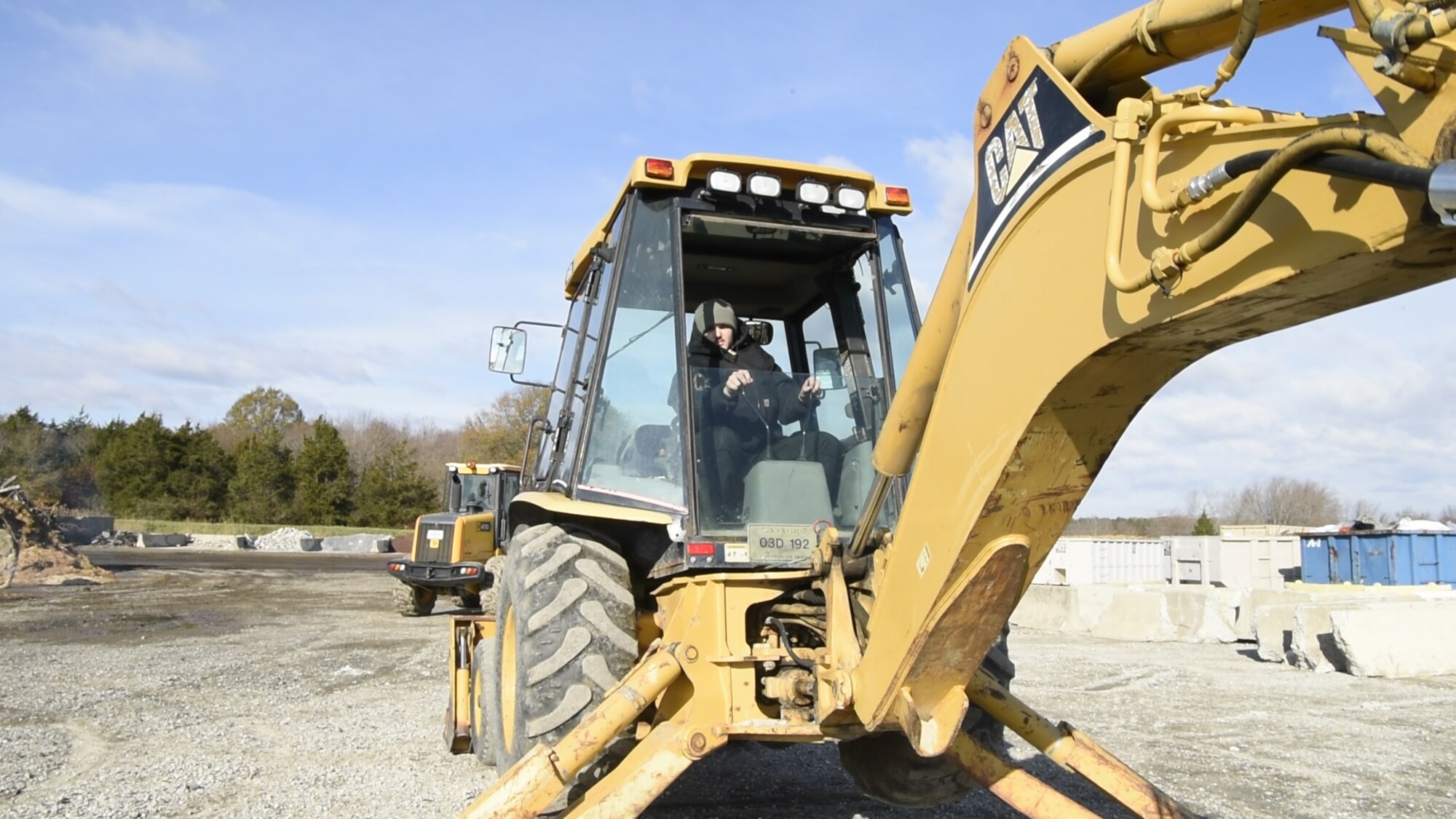 Airman 1st Class Austin Nelson, 436th Civil Engineer Squadron pavements and heavy equipment apprentice, operates a backhoe during Prime Base Engineer Emergency Force (Prime BEEF) Day Nov. 28, 2018, at Dover Air Force Base, Del. Prime BEEF Day is a squadron-wide training day focused on maintaining and refreshing all civil engineering Airmen on readiness requirements and operational capabilities. (U.S. Photo by Airman First Class Dedan D. Dials)