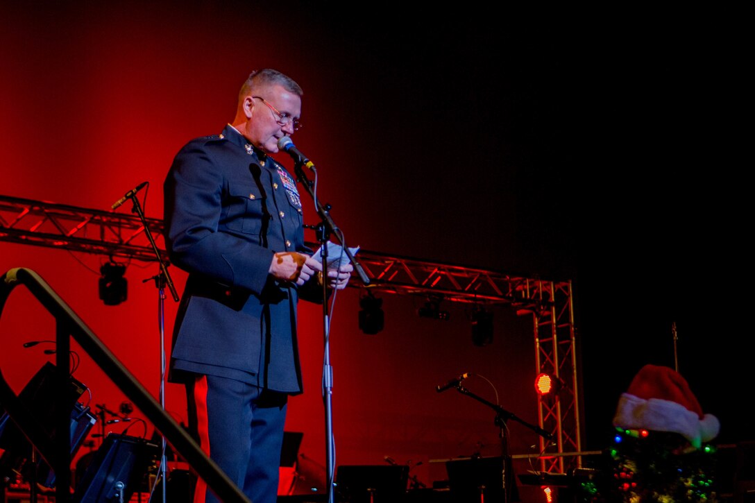 Brig. Gen. Bradley S. James, commander of Marine Forces Reserve and Marine Forces North, thanks the audience for their support of the Toys for Tots program before the annual holiday concert at the Saenger Theatre, New Orleans, Dec. 9, 2018. The performance was one of multiple holiday concerts the band arranged throughout December to promote the Marine Corps Reserve Toys for Tots program, which donates toys to less fortunate children in the community. (U.S. Marine Corps photo by Lance Cpl. Samantha Schwoch)