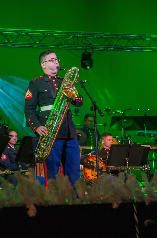 Cpl. Joseph De La Garza, a musician with the Marine Forces Reserve Band, performs a saxophone solo during the annual holiday concert at Saenger Theatre in New Orleans, Dec. 9, 2018. The performance is one of several holiday concerts the band arranged throughout December to promote the Marine Corps Reserve Toys for Tots program, which donates toys to less fortunate children in the community. (U.S. Marine Corps photo by Lance Cpl. Samantha Schwoch)