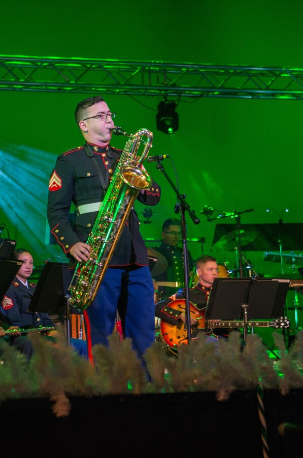 Cpl. Joseph De La Garza, a musician with the Marine Forces Reserve Band, performs a saxophone solo during the annual holiday concert at Saenger Theatre in New Orleans, Dec. 9, 2018. The performance is one of several holiday concerts the band arranged throughout December to promote the Marine Corps Reserve Toys for Tots program, which donates toys to less fortunate children in the community. (U.S. Marine Corps photo by Lance Cpl. Samantha Schwoch)