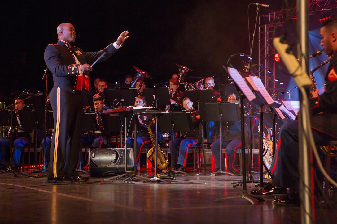 Chief Warrant Officer 2 DeMarius D. Jackson, officer in charge of the Marine Forces Reserve Band, conducts the band during the annual holiday concert at the Saenger Theatre in New Orleans, Dec. 9, 2018. The performance is one of multiple holiday concerts the band arranged throughout December to promote the Marine Corps Reserve Toys for Tots program, which donates toys to less fortunate children in the community. (U.S. Marine Corps photo by Lance Cpl. Samantha Schwoch)