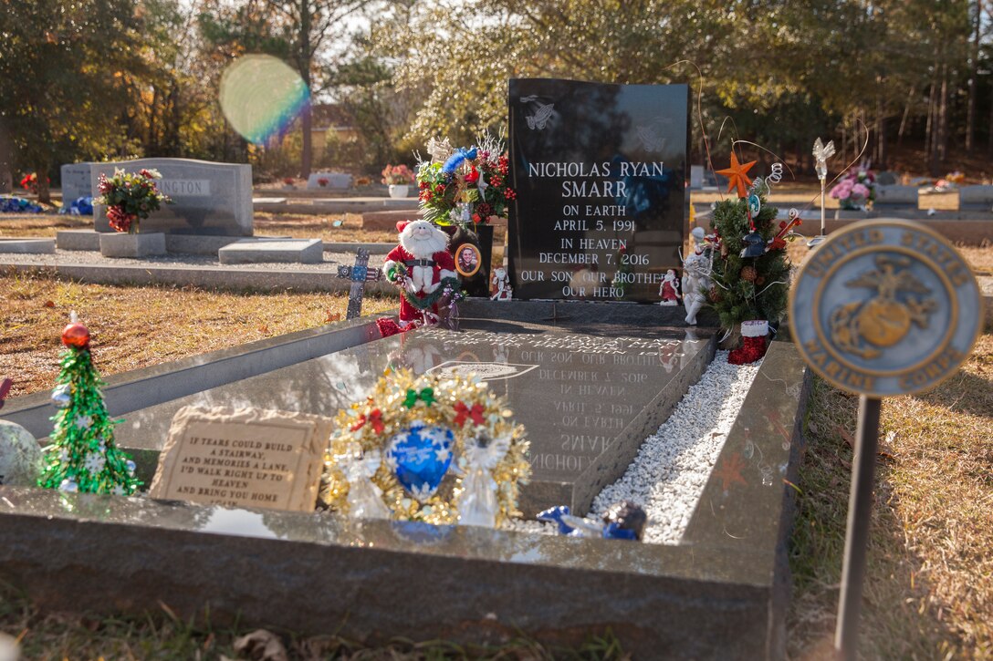 Holiday decorations adorn the final resting place of Lance Cpl. Nicholas R. Smarr, a Reserve Marine killed in the line of duty while serving as a police officer for the Americus Police Department in Americus, Ga. Smarr and fellow officer Jody Smith were killed in action when responding to a domestic disturbance call in Americus on Dec. 7, 2016. (U.S. Marine Corps photo by Cpl. Niles Lee)