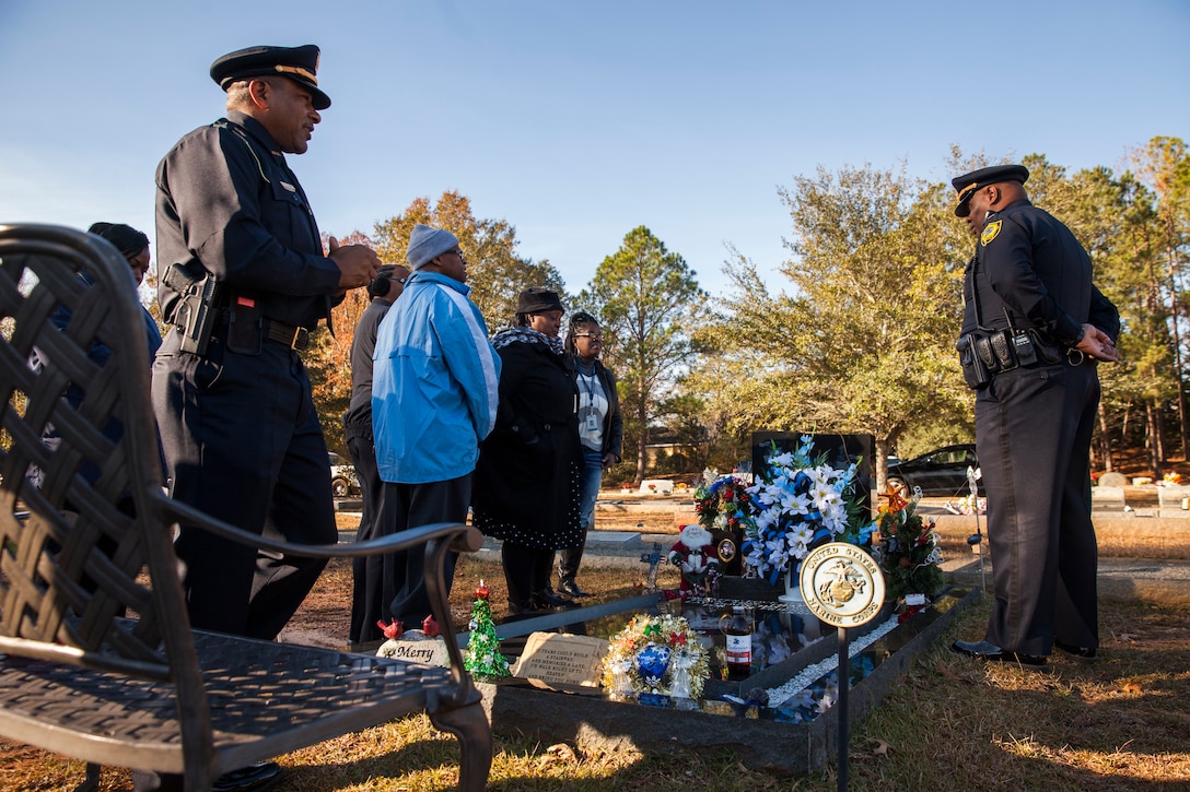Police officers from Americus, Ga., pay their respects to Lance Cpl. Nicholas Smarr, during a wreath laying ceremony at Smarr’s grave site in Americus, Dec. 7, 2018. Smarr and fellow officer Jody Smith were killed in action when responding to a call in Americus on Dec. 7, 2016. Smarr was a Reserve Marine and was posthumously awarded the Navy and Marine Corps Medal for his heroism. (U.S. Marine Corps photo by Cpl. Niles Lee)