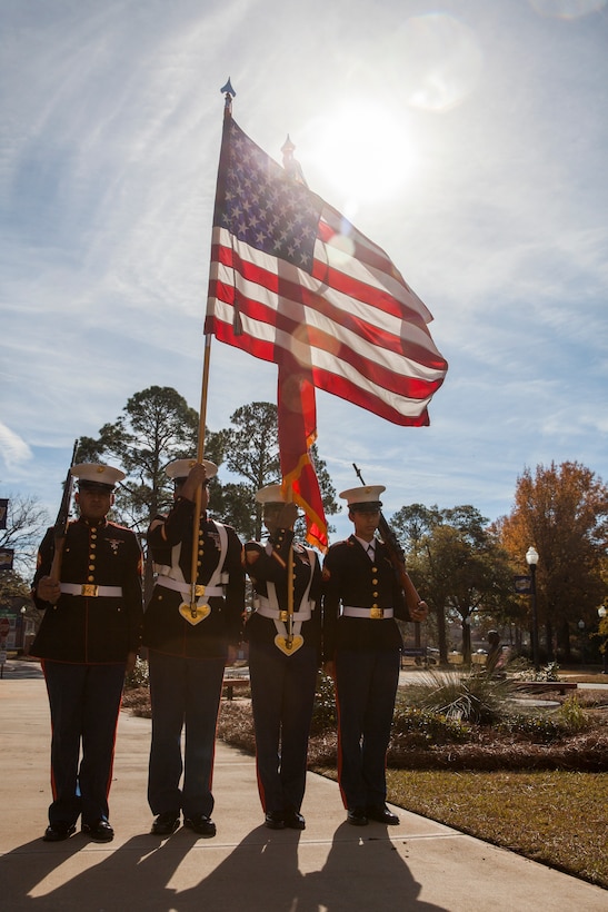 A Marine Corps color guard from Marine Corps Base Albany, Ga., carry the colors during a Navy and Marine Corps Medal award ceremony for Lance Cpl. Nicholas Smarr at Georgia Southwestern State University in Americus, Dec. 7, 2018. Smarr, a Reserve Marine, was posthumously awarded the Navy and Marine Corps Medal for his actions that cost him his life two years ago while serving as a police officer for the Americus Police Department. (U.S. Marine Corps photo by Cpl. Niles Lee)