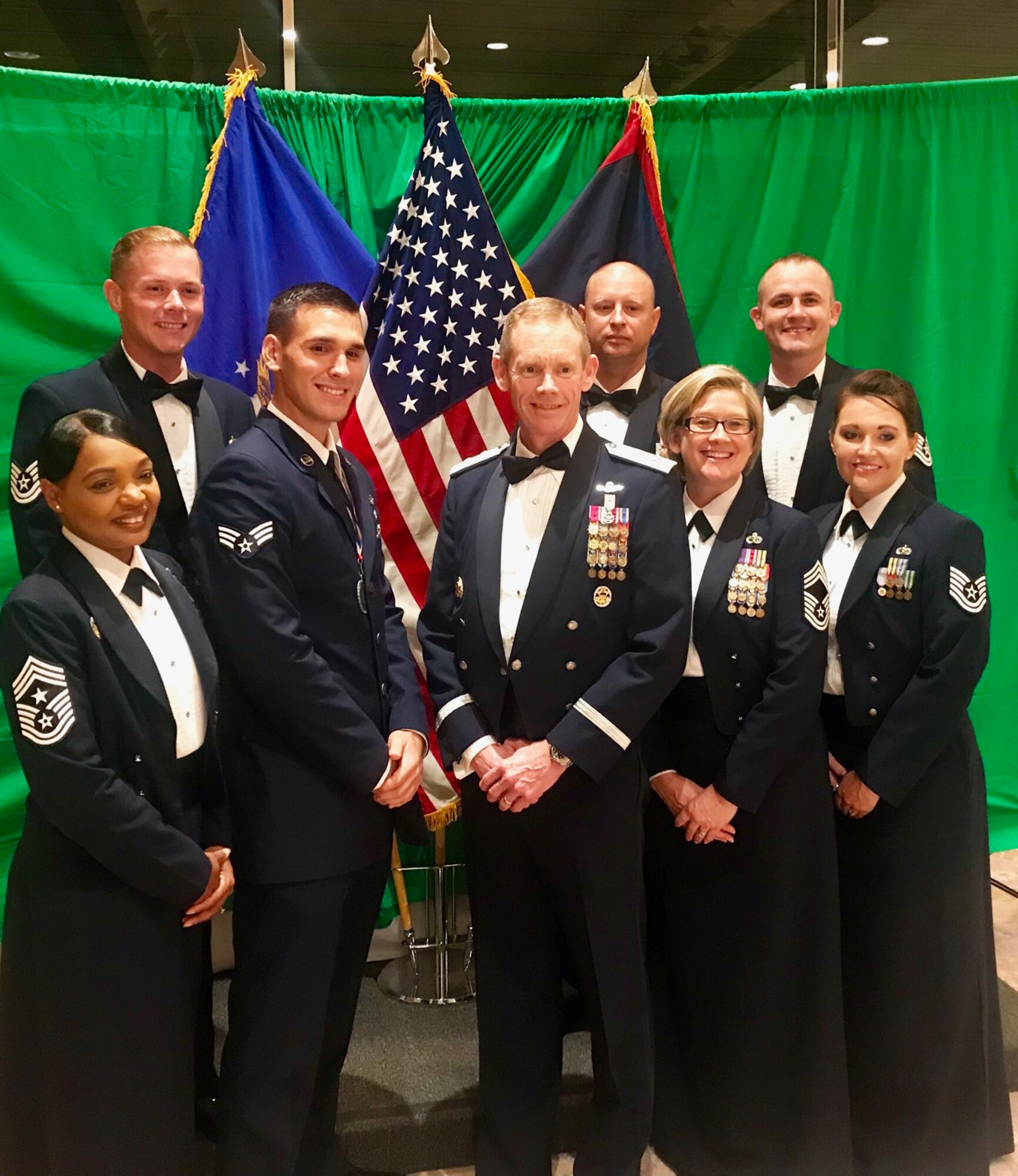 U.S. Air Force Senior Airman Tyler Lewellen, center left, an aerospace ground equipment technician from Detachment 4 and recent graduate of Airman Leadership School Class 19-A, stands with friends and Mighty Eighth leaders Chief Master Sergeant Melvina Smith, 8th Air Force command chief and Joint-Global Strike Operations Center senior enlisted leader, left, Maj. Gen. James Dawkins Jr., 8th AF and J-GSOC commander, center, and Chief Master Sergeant Shelley Cohen, 8th AF command chief and J-GSOC senior enlisted leader IMA, center-right, following his ALS graduation at Anderson Air Force Base, Guam, Dec. 6. In a class comprised of 32 Soldiers, Airmen, Seamen and DOD civilians, Lewellen earned special recognition as the distinguished graduate and academic achievement award. (U.S. Air Force courtesy photo)