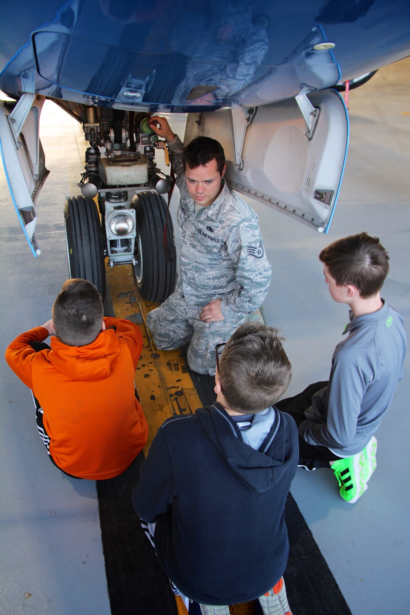 Staff Sgt. David Schallenberg helps the 932nd Airlift Wing welcome eighth grade Science, Technology, Engineering, and Mathematics (STEM) students for a visit December 10, 2018, at Scott Air Force Base, Illinois. Schallenberg, a C-40 aircraft maintainer from the 932nd Maintenance Group, speaks to local Mascoutah students about how an airplane engine, wheels, tires, hydraulics and wings work to get a plane off the ground. He manned this informational station as multiple groups of students rotated through his area every 45 minutes at the reserve unit in southern Illinois near Belleville.  (U.S. Air Force photo by Lt. Col. Stan Paregien)