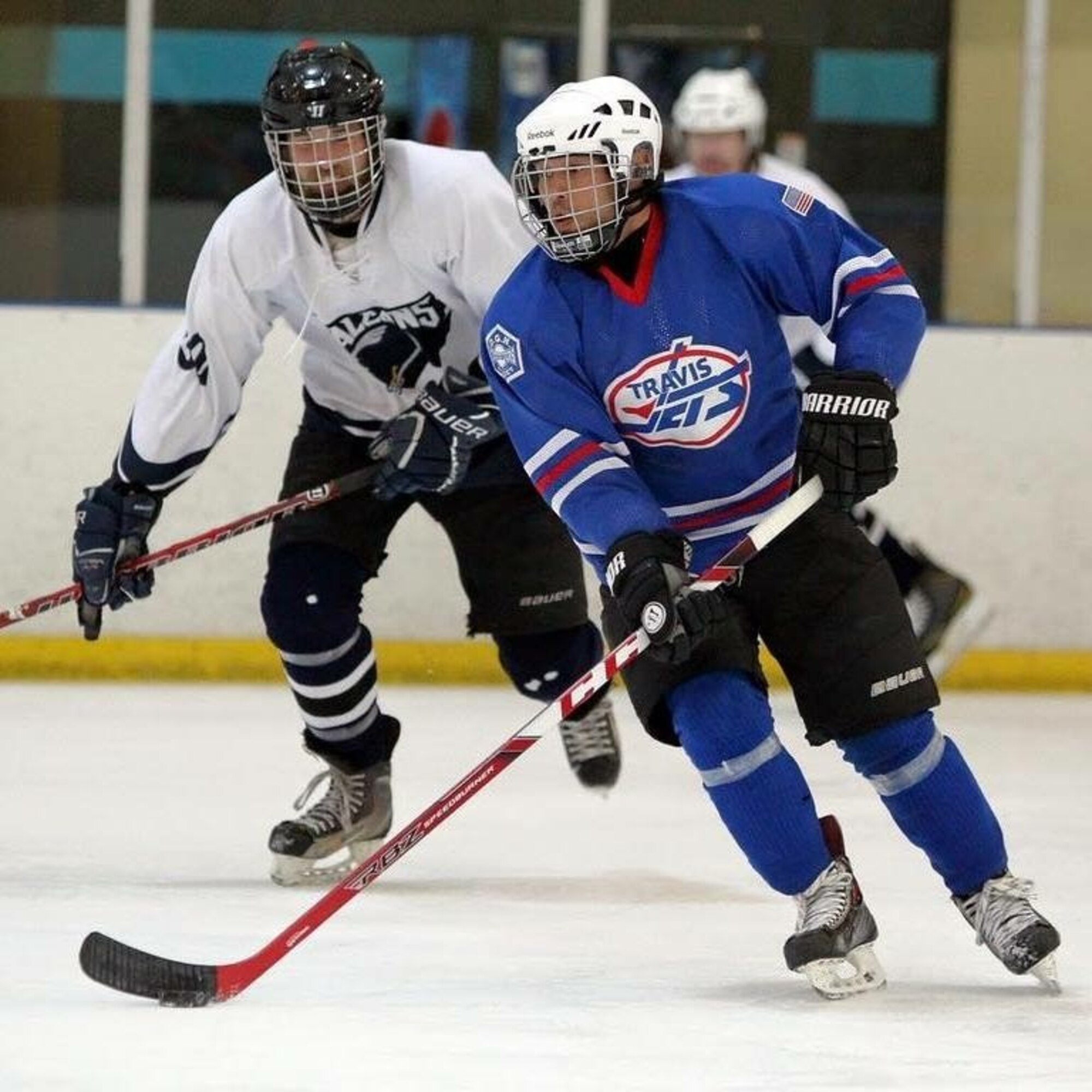 U.S. Air Force Staff Sgt. Justin Rico, 60th Civil Engineer Squadron Fire Emergency Services training NCO in charge, keeps the puck away from the opposing team during a game at the Armed Services Hockey Association Las Vegas International Championships which was held Nov. 11, 2018, in Las Vegas, Nevada. Rico was awarded MVP after his team lost in the final game, 3-2. (courtesy photo)