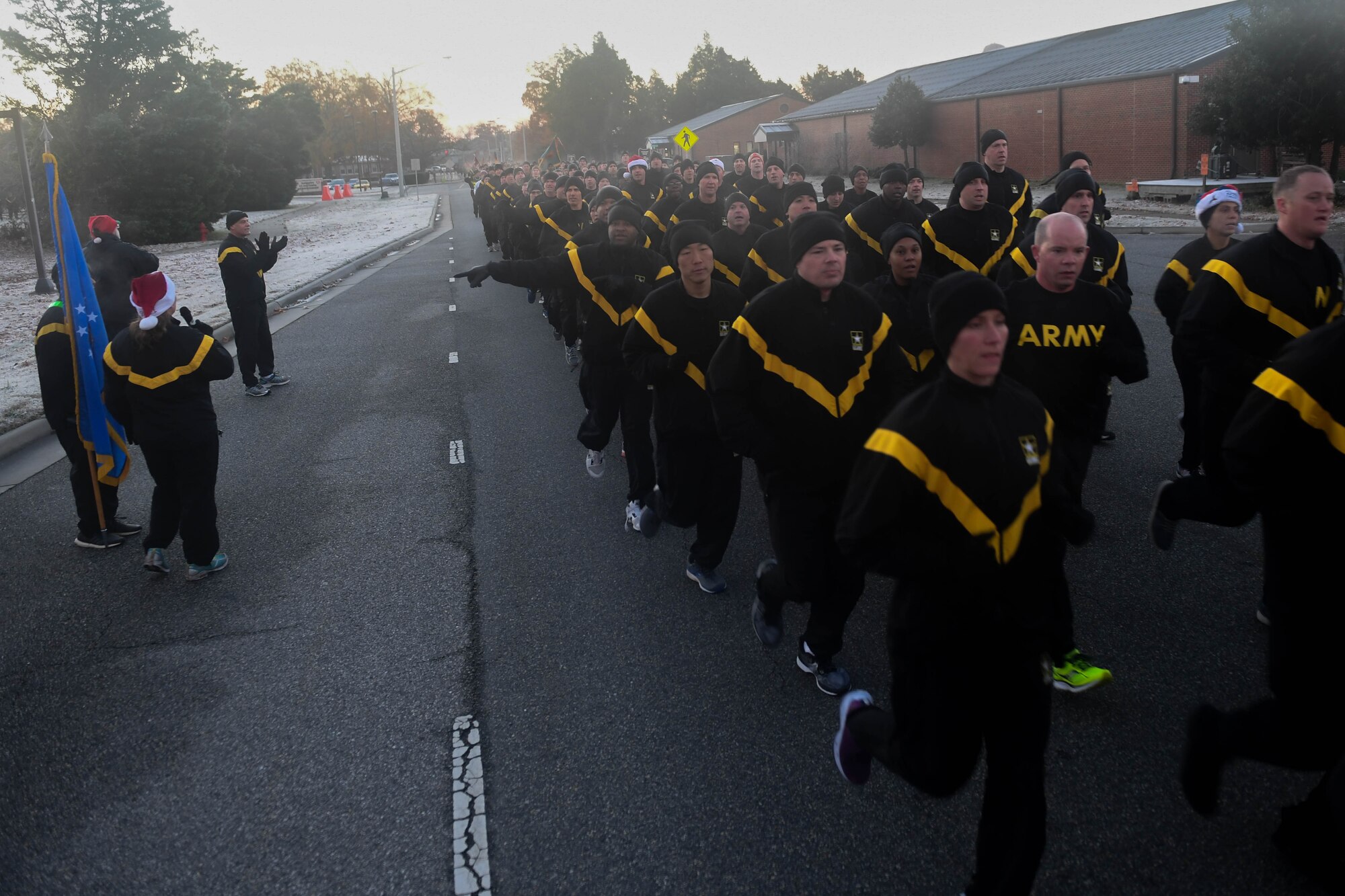 U.S. Army Soldiers participate in an installation formation run to mark the end of the Toys for Tots donation drive at Joint Base Langley-Eustis, Virginia, Dec. 6, 2018. U.S. Army Pvt. Ian Smith, Charlie Company, 222nd Aviation Regiment, 1st Battalion, 128th Avn. Brigade Advanced Individual Training student, donated over $1,000 worth of toys because he was personally affected by someone who donated toys when he was a child. (U.S. Air Force photo by Senior Airman Derek Seifert)