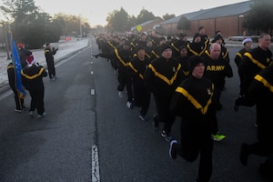 U.S. Army Soldiers participate in an installation formation run to mark the end of the Toys for Tots donation drive at Joint Base Langley-Eustis, Virginia, Dec. 6, 2018. U.S. Army Pvt. Ian Smith, Charlie Company, 222nd Aviation Regiment, 1st Battalion, 128th Avn. Brigade Advanced Individual Training student, donated over $1,000 worth of toys because he was personally affected by someone who donated toys when he was a child. (U.S. Air Force photo by Senior Airman Derek Seifert)
