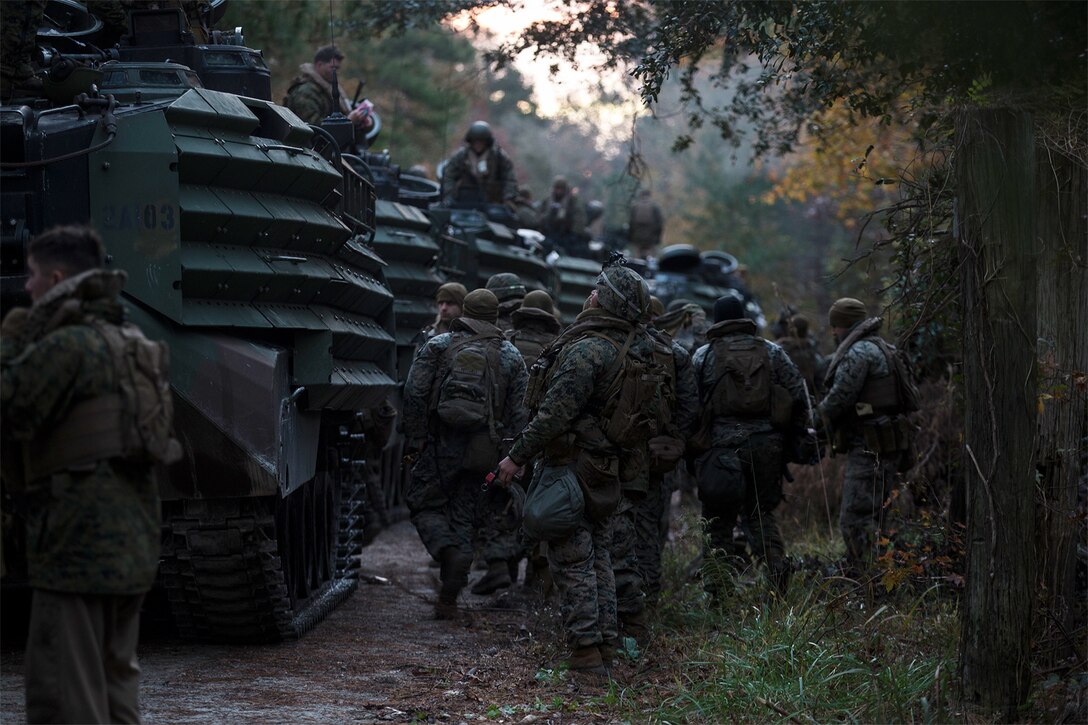 Marines prepare to conduct a river crossing.