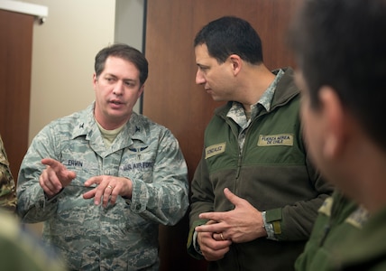 Col. (Dr.) Mark Erwin, 59th Medical Wing Operational Medicine chief, speaks to Chilean Air Force Maj. Pablo Gonzalez, medical health officer, on Dec. 7, at Wilford Hall’s Simulation Center on Joint Base San Antonio-Lackland, Texas. Members from the Chilean Air Force visited the 59th MDW to gain a better understanding of Critical Care Air Transportation Teams. (U.S. Air Force photo by Kiley Dougherty)