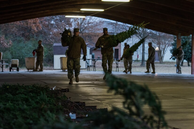 U.S. Army Soldiers unload evergreen trees donated by the Christmas SPIRIT Foundation’s Trees for Troops program at Joint Base Langley-Eustis, Virginia, Dec. 7, 2018.