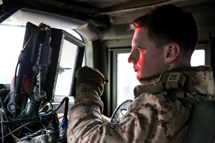 U.S. Marine Corps Lance Cpl. Truman Jackson, a data systems administrator with II Marine Support Battalion, II Marine Information Group, communicates with command operations center during a convoy operation for Exercise Trident Juncture 18 in Norway, Nov. 2, 2018. Trident Juncture 18 demonstrates II Marine Expeditionary Force’s ability to deploy, employ, and redeploy the Marine Air Ground Task Force while improving interoperability with NATO allies and partners. (U.S. Marine Corps photo by Cpl. Patrick Osino)