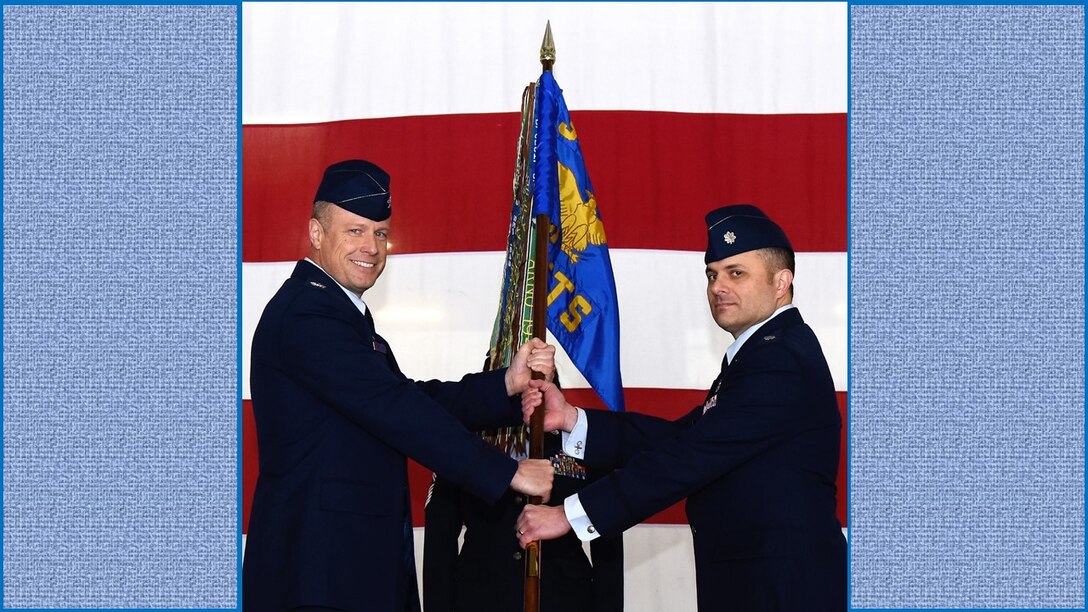 Lt. Col. Vincent Danna, right, accepts the 96th Flying Training Squadron guidon from Col. Allen Duckworth, 340th Flying Training Group commander, during an assumption-of-command ceremony held Dec. 6 at Laughlin Air Force Base, Texas. (U.S. Air Force photo by Airman 1st Class Anne McCready)