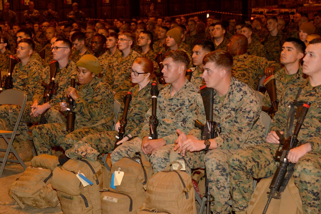 Approximately 300 Marines from units all across II Marine Expeditionary Force receive an orientation brief after arriving at Vaernes Air Station, Norway, from Camp Lejeune, N.C., on Oct. 3, 2018, in order to participate in Exercise Trident Juncture 2018. Trident Juncture 18 enhances the U.S. and NATO Allies' abilities to work together collectively to conduct military operations under challenging conditions. (U.S. Marine Corps photo by GySgt. Rebekka S. Heite)