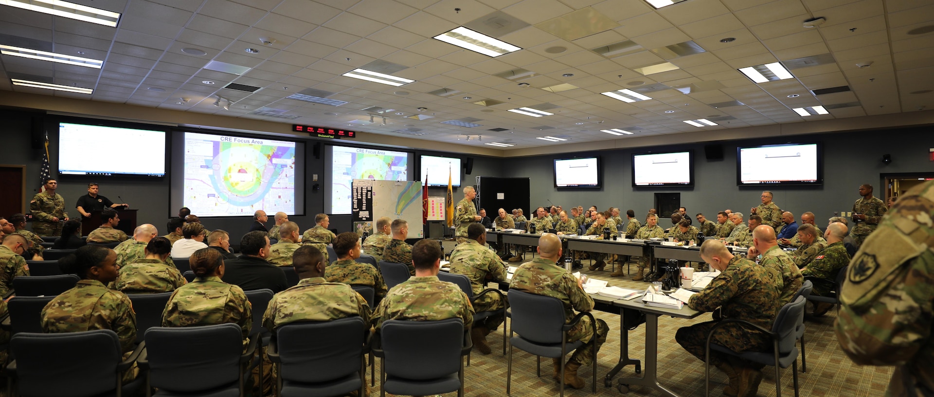 U.S. Army Maj. Gen. Bill Hall, JTF-CS commander speaks to senior leaders and representatives at the Mission Planning Conference (MPC), Fort Eustis, Va., Dec. 3-4, 2018. The MPC prepared and strengthened communication roles of the Defense Chemical, Biological, Radiological and Nuclear (CBRN) Response Force (DCRF) and other DoD CBRN Response Enterprise (CRE) entities for participation in response operations. In the event of a catastrophic CBRN incident, the JTF-CS and DCRF missions assist local, state, federal and tribal partners in saving lives, preventing further injury, and providing critical support to enable community recovery when conducting Defense Support of Civil Authorities (DSCA) response operations.
 
“This is also a good stage setter for Exercise Sudden Response/Determined Response in January 2019 because we addressed important issues and solutions, leading to an action plan for success,” said Hall. (DoD photo by U.S. Air Force Tech. Sgt. Michael Campbell/ Released)