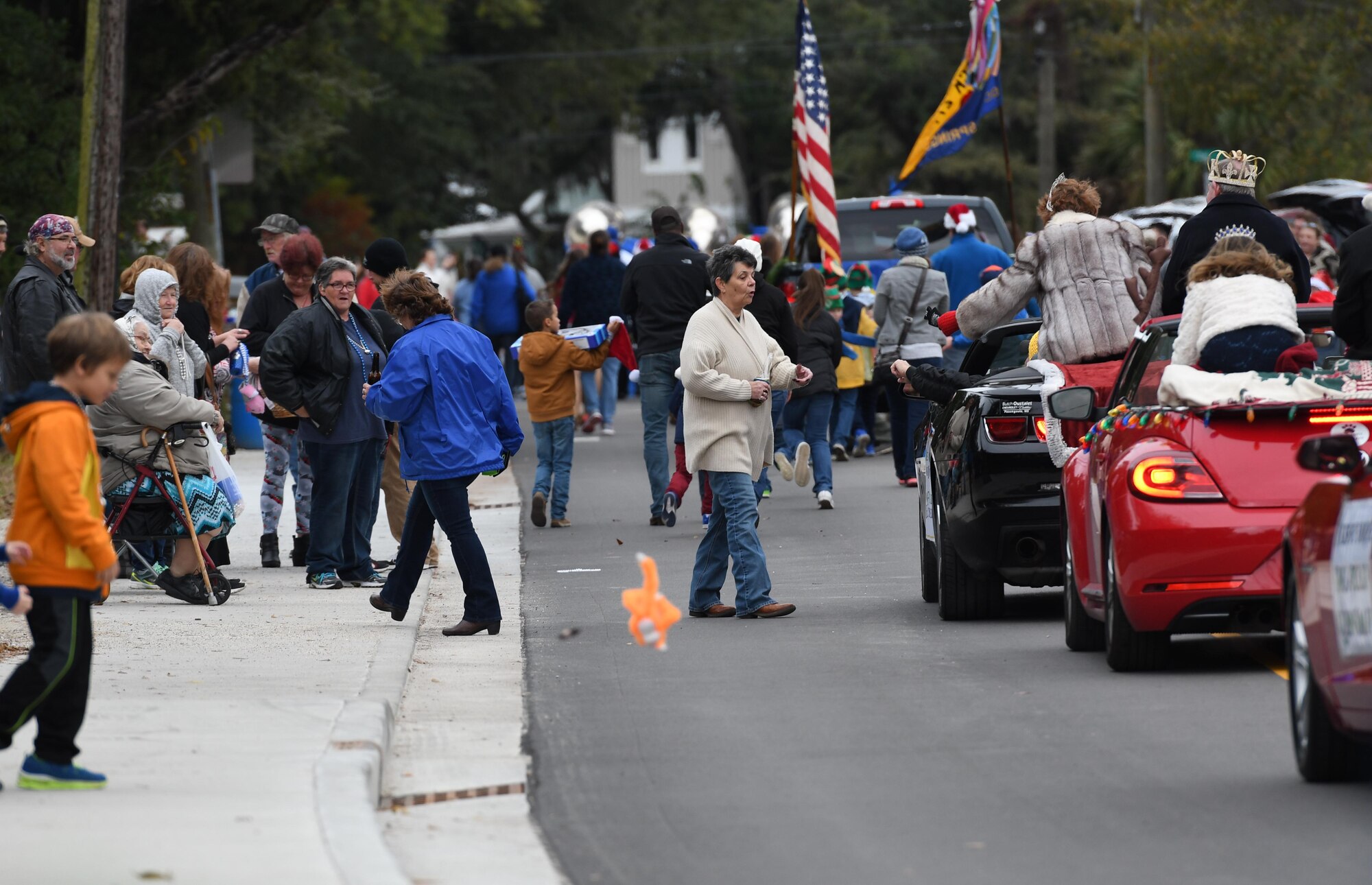 Residents attend the Ocean Springs Christmas Parade in Ocean Springs, Mississippi, Dec. 9, 2018. The Keesler Air Force Base Honor Guard and 81st Training Group Airmen participated in the event. (U.S. Air Force photo by Kemberly Groue)