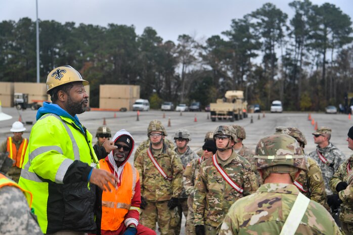A member of the 841st Transportation Battalion gives a safety briefing Dec. 10, 2018, at Joint Base Charleston, S.C.