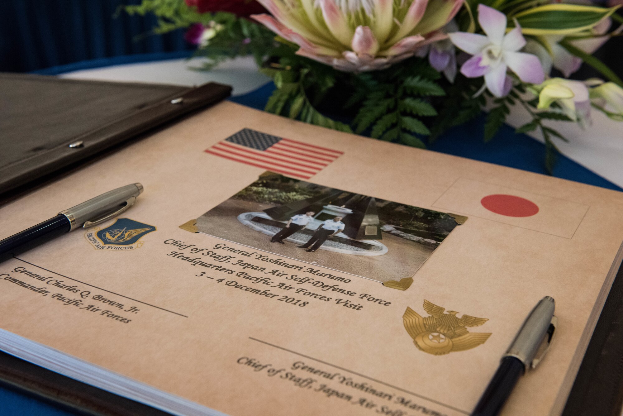 Gen. Yoshinari Marumo, Japanese Air Self-Defense Force chief of staff, and Gen. CQ Brown, Jr., Pacific Air Forces commander, sign a guest book during Marumo’s visit to Headquarters Pacific Air Forces on Joint Base Pearl Harbor-Hickam, Hawaii, Dec. 4, 2018. As part of his trip, Marumo met with PACAF leadership to discuss the PACAF strategy and future engagements. The U.S. and Japan routinely work together to promote security cooperation and support a free and open Indo-Pacific region. (U.S. Air Force photo/Staff Sgt. Hailey Haux)