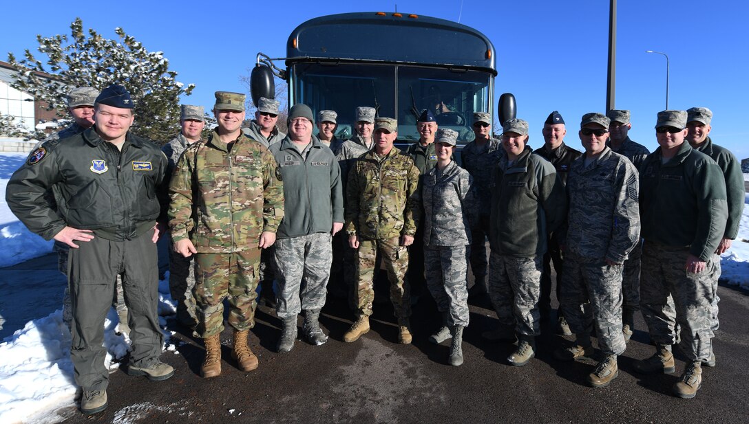 Several chief master sergeants 28th Bomb Wing leadership stand in front of the “chiefs’ bus” at Ellsworth Air Force Base, S.D., Dec. 4, 2018. Ellsworth AFB members traveled on the chiefs’ bus to the 28th Security Forces Squadron to congratulate Senior Master Sgt. Jesse Frank, the 28th SFS operations superintendent, on earning the title of chief master sergeant. (U.S. Air Force photo by Airman 1st Class Thomas Karol)