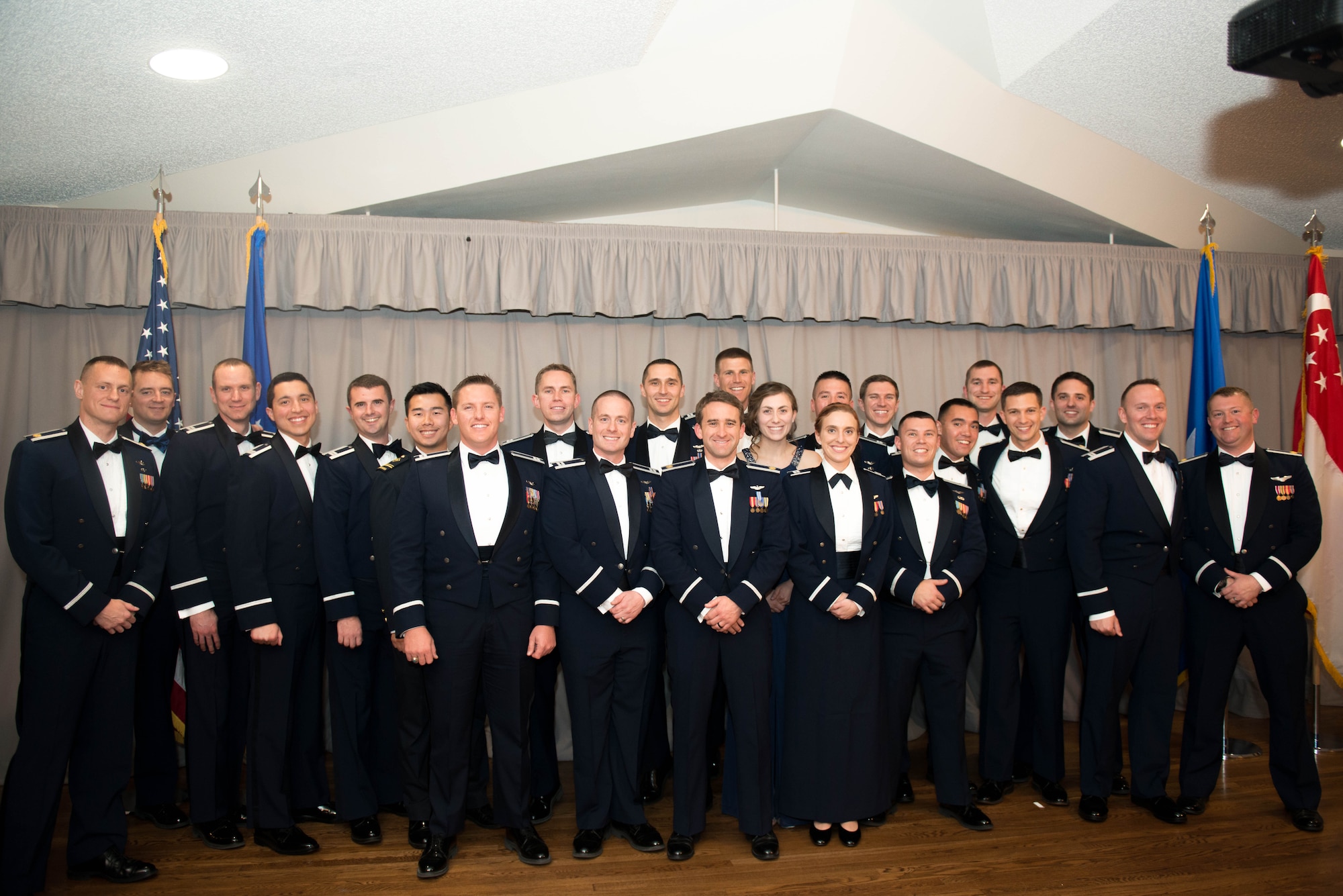 United States Air Force Test Pilot School Class 18A stood proudly before friends, families, base leadership and fellow testers at Club Muroc as they received their Master of Science Degree in Flight Test Engineering Dec. 7. (U.S. Air Force photo by Joe Jones)