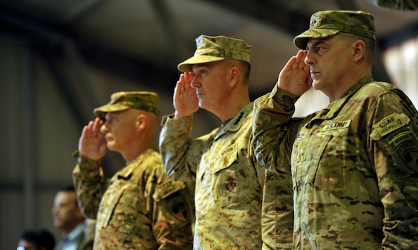 Chairman of the Joint Chiefs of Staff Marine Corps Gen. Joe Dunford (center), then commander of the International Security Assistance Force in Afghanistan, and then Army Lt. Gen. Mark Milley (right), render honors during a change of command ceremony at Kabul International Airport, Afghanistan, May 2, 2013. In a tweet Dec. 8, 2018, President Donald J. Trump indicated he will nominate Milley as the next chairman. Milley, now a four-star general, is the Army chief of staff. (Photo Credit: U.S. Army photo by Staff Sgt. Daniel Wallace)