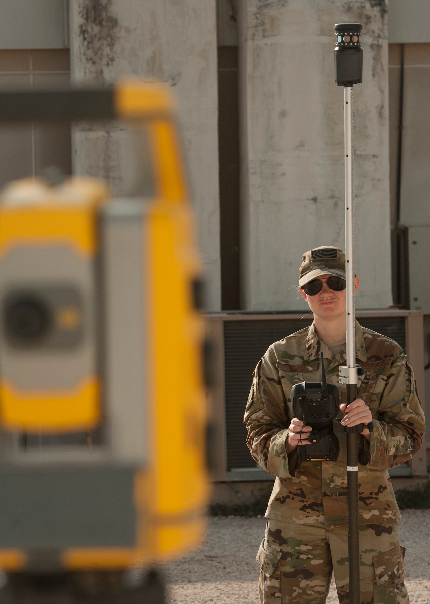 Senior Airman Jessica Kraus, 379th Expeditionary Civil Engineer Squadron geobase technician, tests the pairing of GPS surveying equipment as part of an operations check Dec. 11, 2018, at Al Udeid Air Base, Qatar. Kraus is responsible for creating and updating installation maps with the use of geospatial information system equipment and automated computer-aided design and drafting software. She also provides surveying support to construction that occurs on Al Udeid. (U.S. Air Force photo by Tech. Sgt. Christopher Hubenthal)