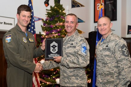 Col. Clint ZumBrunnen, 437th Airlift Wing commander, left, and Chief Master Sgt. Ronnie Phillips, 437th AW command chief, right, congratulate chief select, Senior Master Sgt. Michael Murray, 437th Aircraft Maintenance Squadron flight superintendent, during a release party held Dec. 7, 2018, at Joint Base Charleston, S.C. A release party was held in their honor at the Charleston Club, where base members gathered in support and celebration.