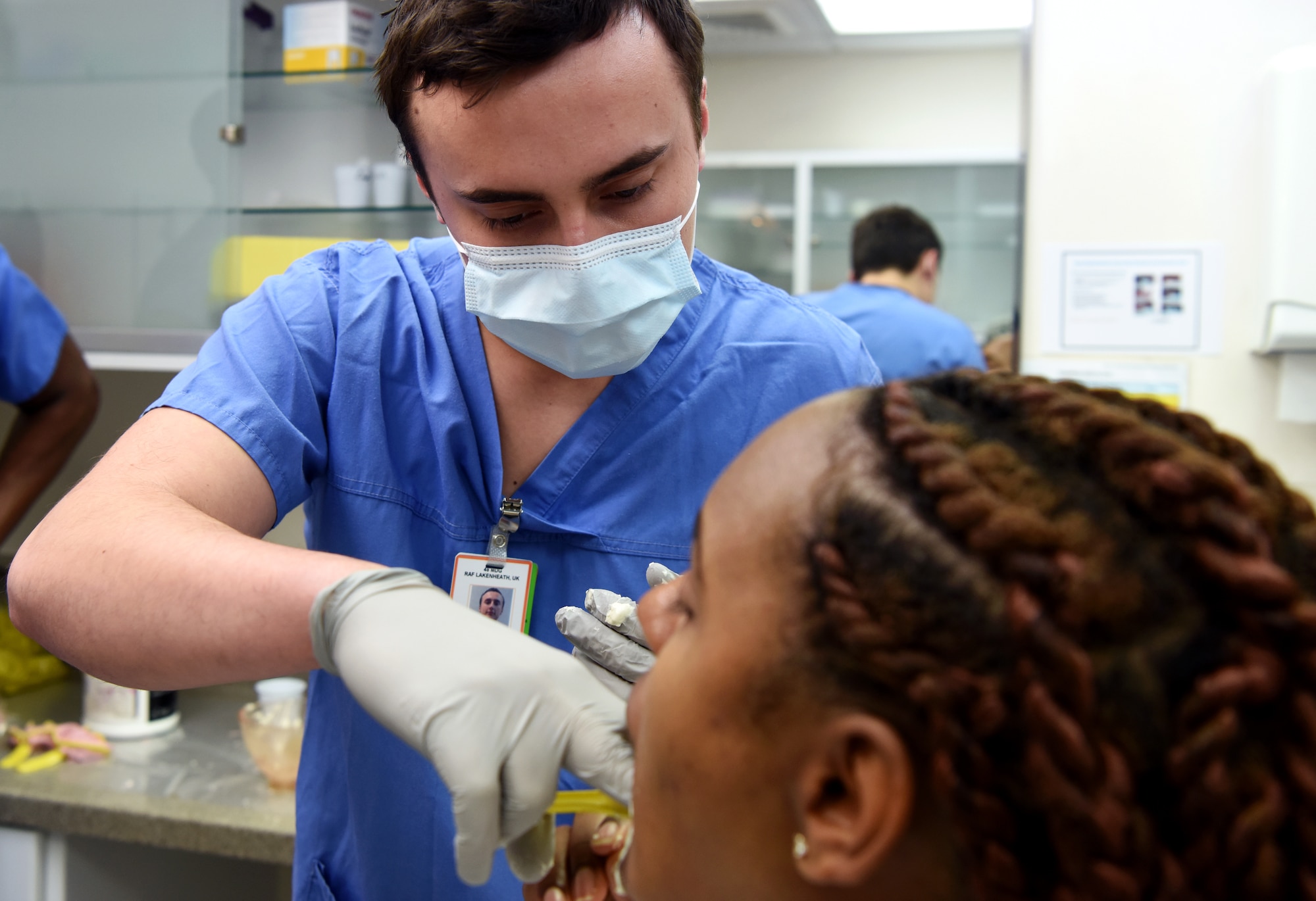 U.S. Air Force Airman 1st Class Mykyta Ryzhkov, 48th Dental Squadron dental technician, forms dental impressions for a Team Mildenhall Airman at the RAF Mildenhall Dental Clinic, RAF Mildenhall, England, Dec. 3, 2018. The 48th DS consists of four flights – the dental clinic, dental support and dental laboratory on RAF Lakenheath and the dental clinic on RAF Mildenhall. (U.S. Air Force photo by Airman 1st Class Brandon Esau)