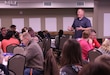 Chaplain (Capt.) Joseph Ledger, brigade chaplain, 646th Regional Support Group, teaches the first lesson of 7 Habits from Franklin Covey during a family Strong Bonds retreat in Bloomington, Minnesota, December 7, 2018. He tells of his personal struggle balancing being overly critical about the cleanliness of his house, and maintaining a positive relationship with his family.