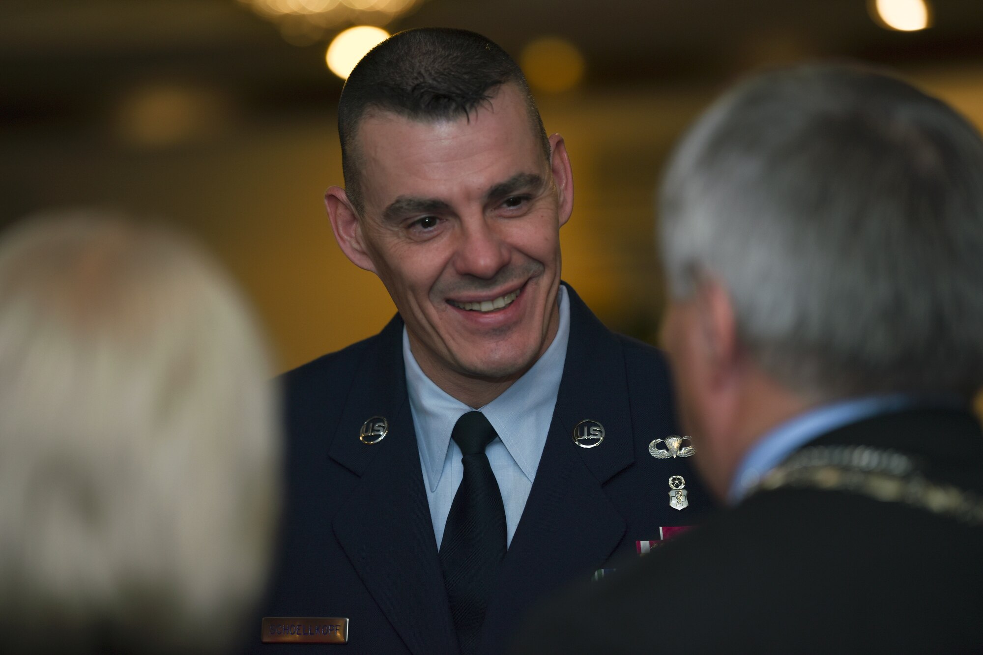 U.S. Air Force Chief Master Sgt. Schoellkopf, 48th Fighter Wing command chief, socializes with Honorary Commanders during the Yuletide reception at Royal Air Force Lakenheath, England, Dec. 7, 2018. The U.S. and UK partnership is longstanding, and is maintained through efforts like this. (U.S. Air Force photo by Airman 1st Class Madeline Herzog)