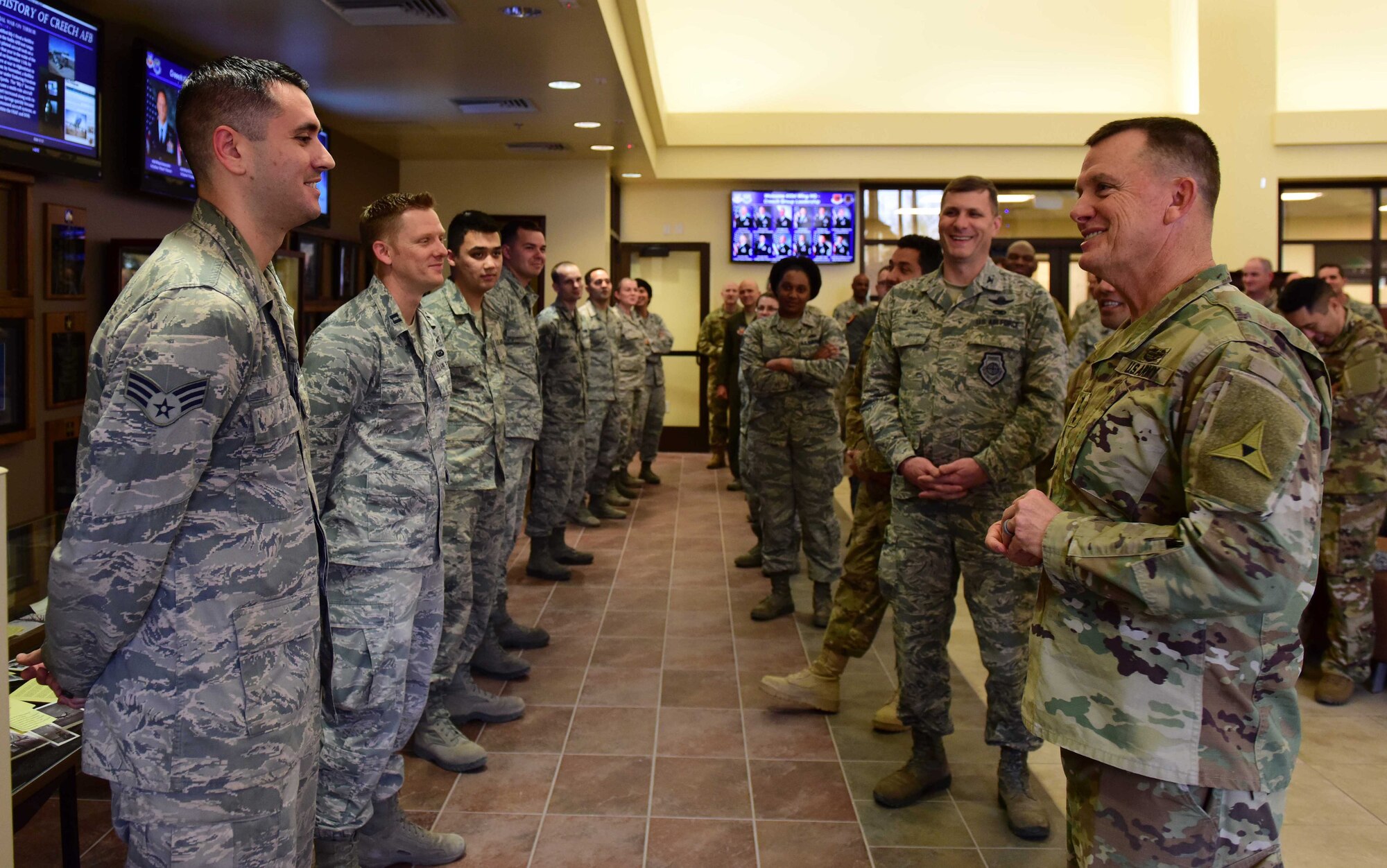 U.S. Army Lt. Gen. Paul Funk, III Armored Corps and Fort Hood, Texas, commanding general recognizes Creech Airmen for exemplary job performance at Creech Air Force Base, Nevada, Dec. 10, 2018. This visit was an opportunity for Funk to meet with the Remotely Piloted Aircraft Airmen who fly, maintain and support the MQ-9 Reaper that has been providing airstrike capabilities for his ground troops since the start of Operation Inherent Resolve in June 2014. (U.S. Air Force Photo by Airman 1st Class Haley Stevens)