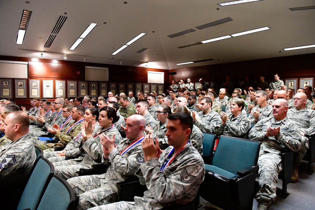 Members of the Western Air Defense Sector clap during the 2018 WADS annual awards ceremony Dec. 1, 2018 on Joint Base Lewis-McChord, Washington.