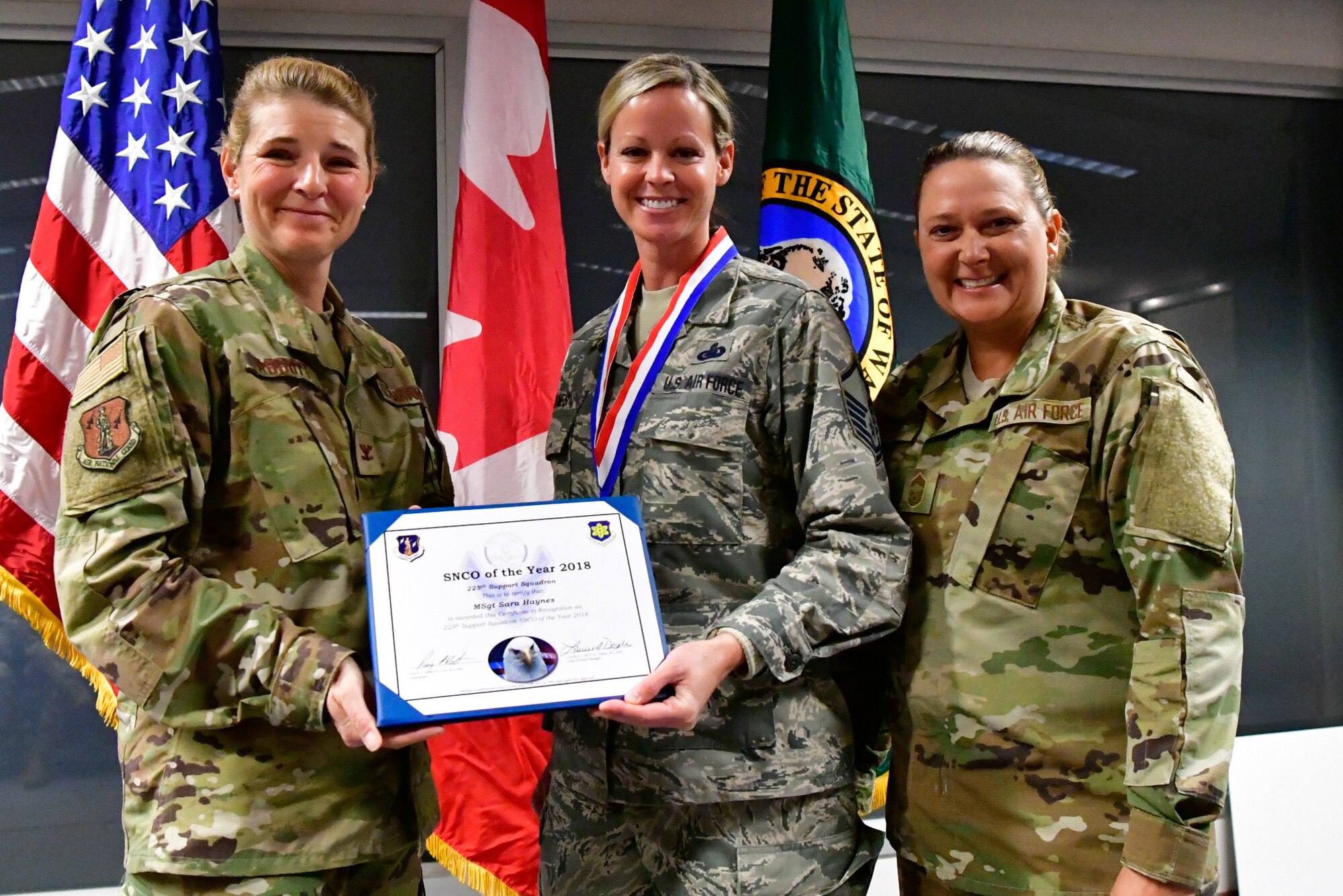 Master. Sgt. Sara Haynes, 225th Support Squadron NCOIC of logistics is named the 225th Support Squadron SNCO of the Year Dec. 1, 2018 on Joint Base Lewis-McChord.  Haynes poses with Col. Paige Abbott (left), 225th SS commander and Chief Master Sgt. Laurie Doyle, 225th SS chief enlisted manager. (U.S. Air National Guard photo by Maj. Kimberly D. Burke)