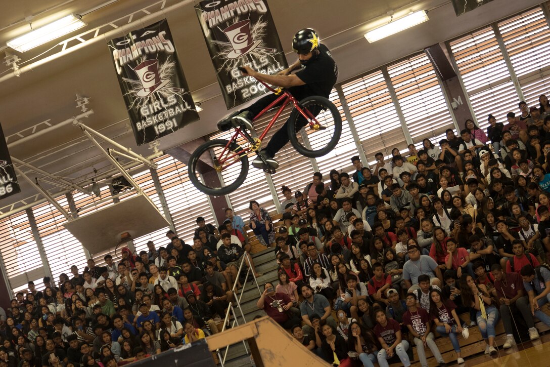 Mykel Larrin, a professional BMX rider, performs for the students of Farrington High School during an Action Sports Association (ASA) High School Tour, in Honolulu, HI, Dec. 5, 2018.