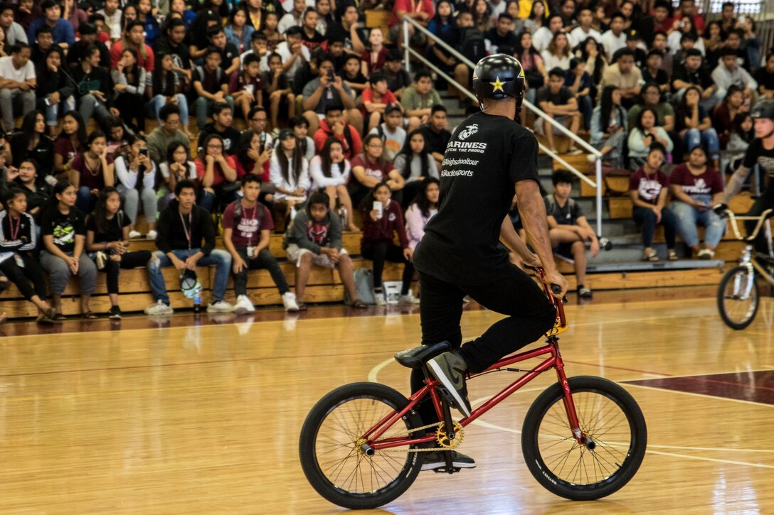 Mykel Larrin, a professional BMX rider, performs for the students of Farrington High School during an Action Sports Association (ASA) High School Tour, in Honolulu, HI, Dec. 6, 2018.