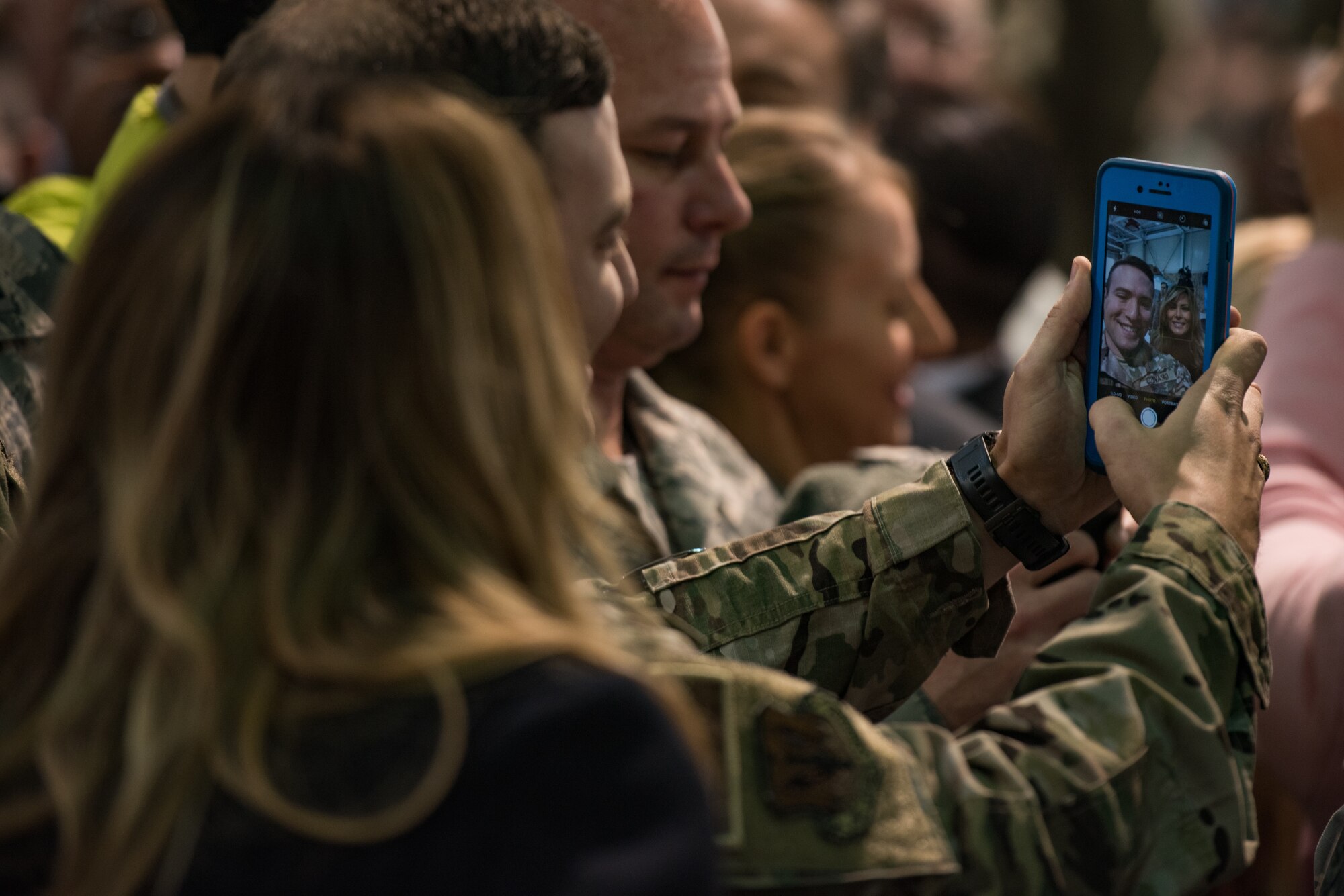 First Lady Melania Trump takes a selfie with a U.S. Air Force Airman at Joint Base Langley-Eustis, Virginia, Dec. 12, 2018.