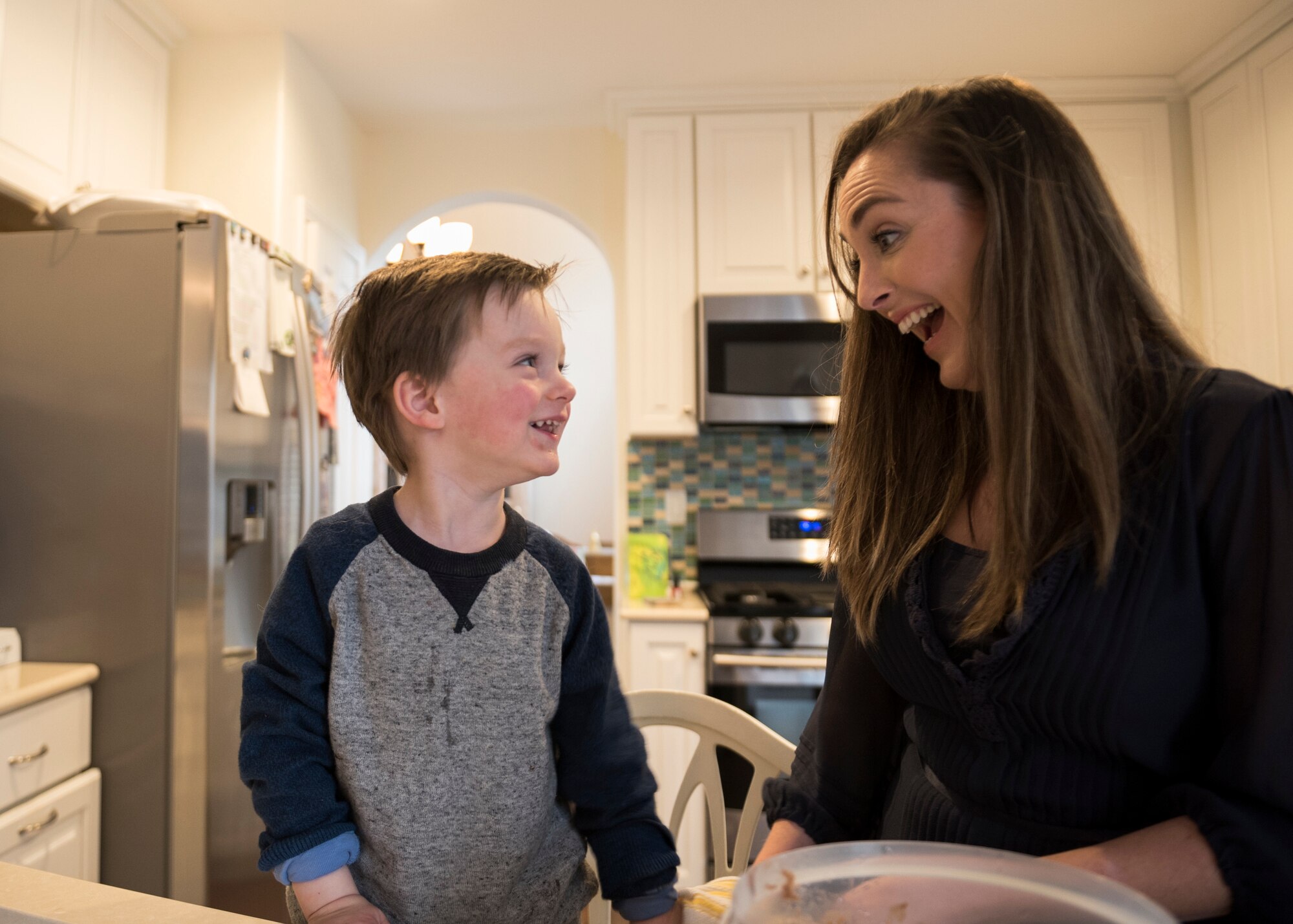 Morgan Noller laughs with her son, Camden, in their home in Vacaville, California, Dec. 5, 2018. Noller won the 2018 Joan Orr Air Force Spouse of the Year Award. (U.S. Air Force photo by Lan Kim)